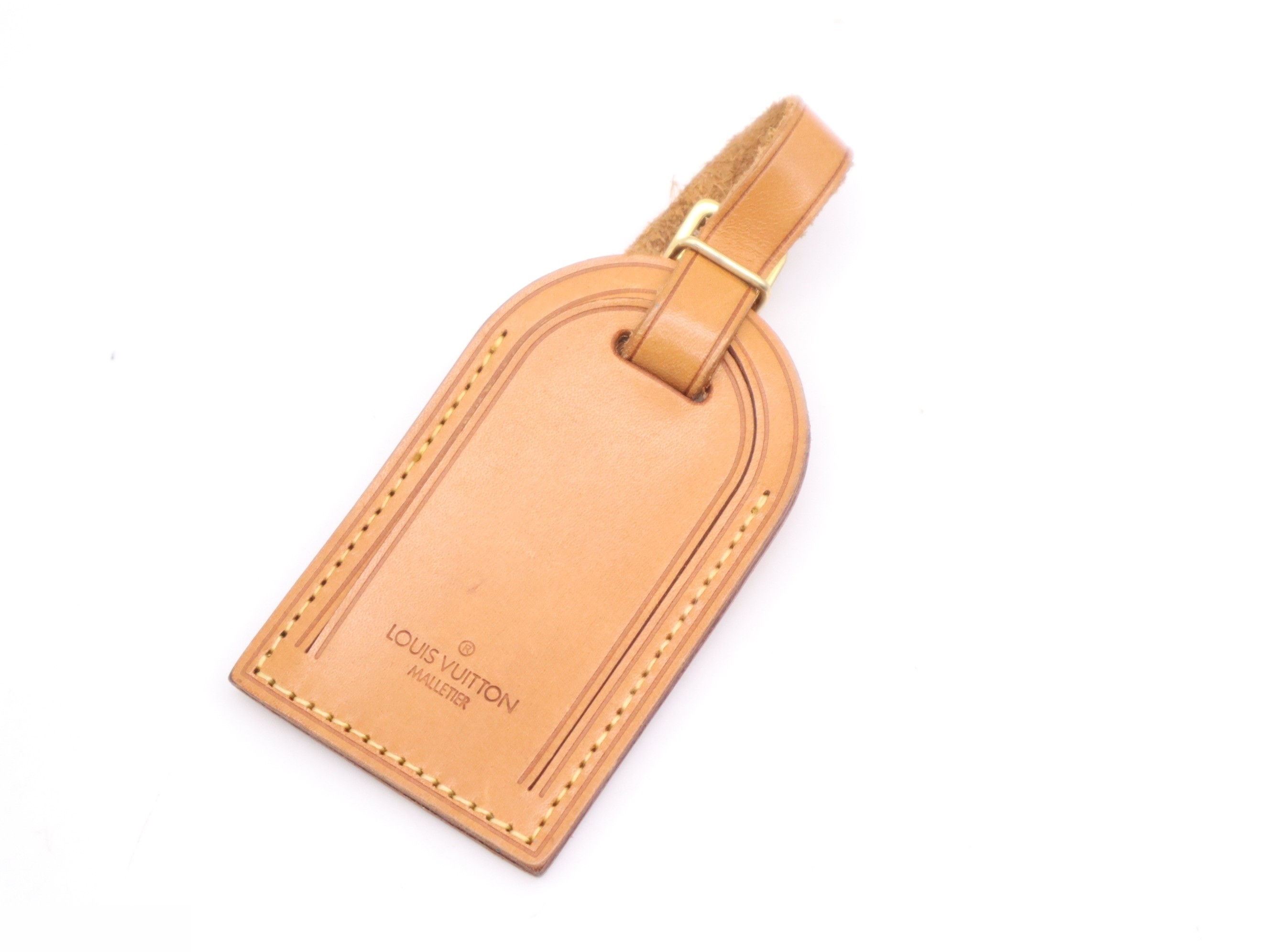 Keepall Bandoulière 55 with shoulder strap, padlock, and name tag. — view 9