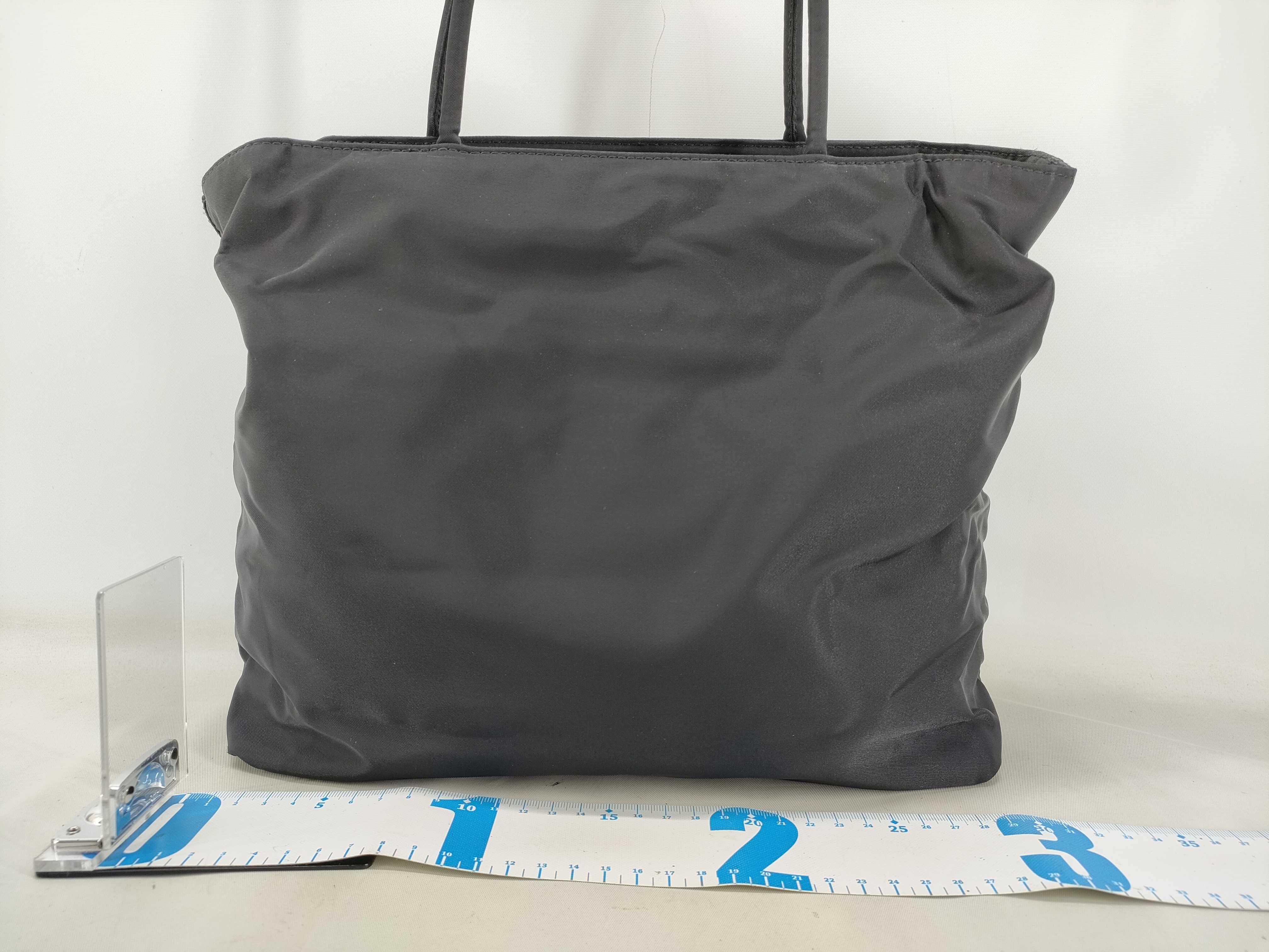nylon tote bag, black, with zipper and white tag, size 58. — view 2