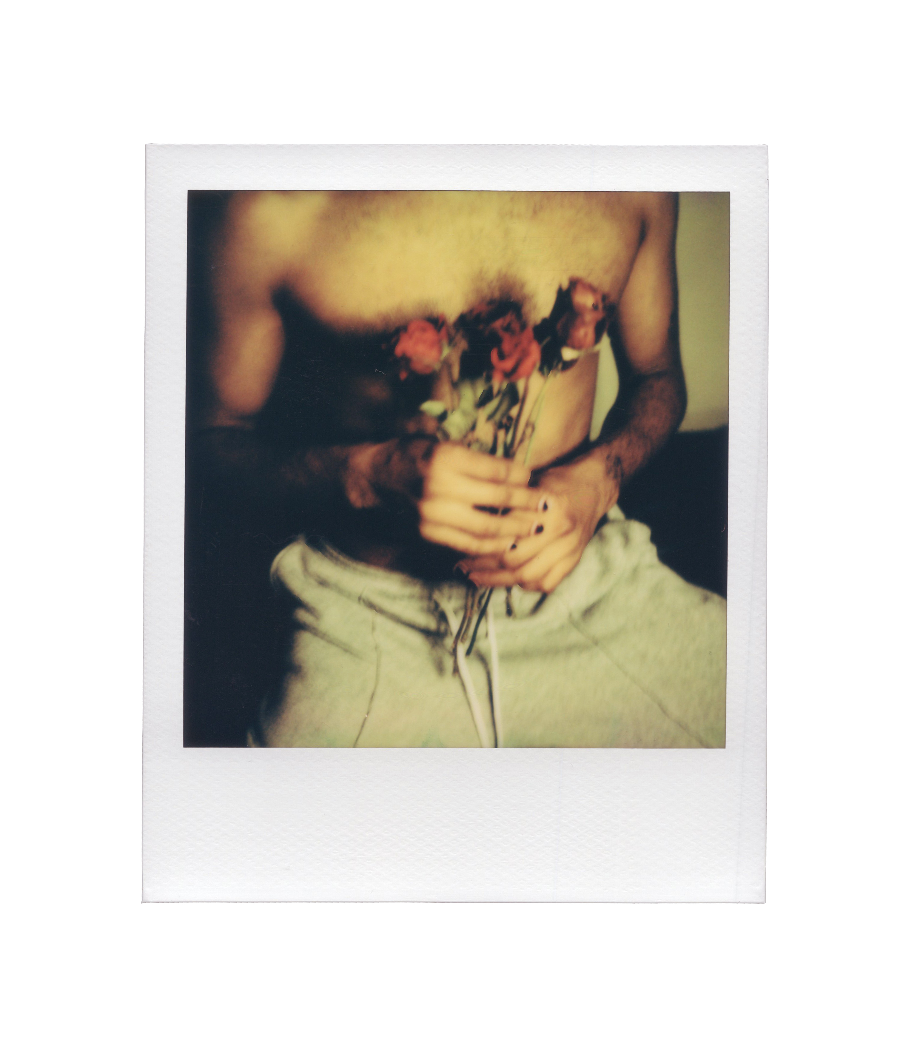 Alfred holds five roses