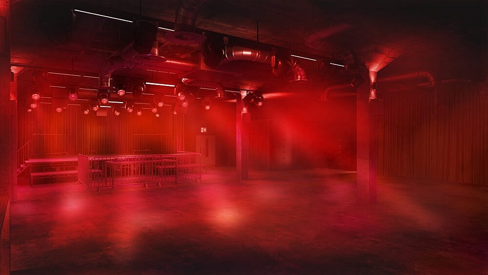 Der neue Locker-Raum unter New Century in Manchester ist in rotes Licht getaucht, mit niedriger Decke, Säulen und DJ-Fläche.