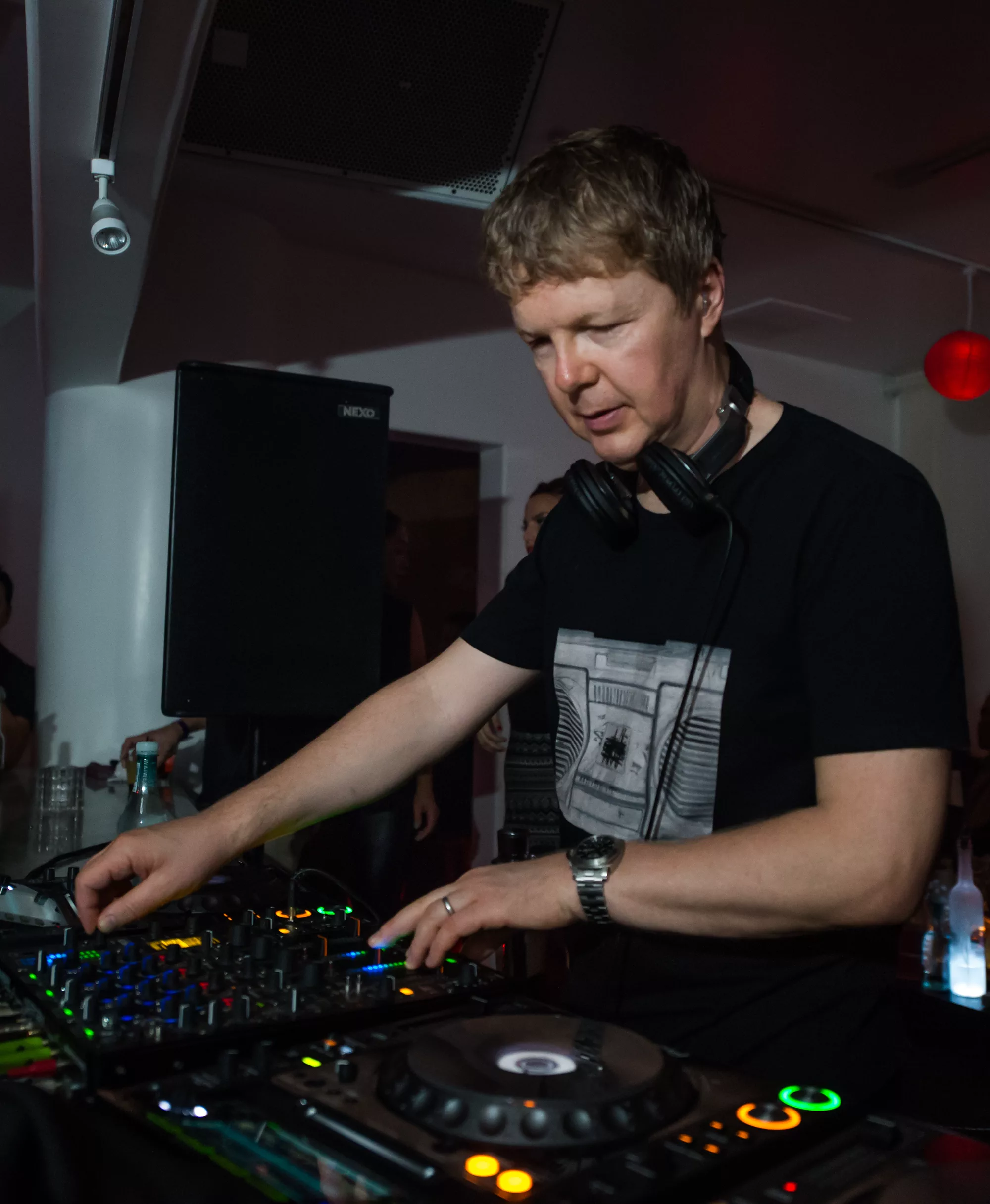 John Digweed performing behind DJ equipment at Eleven44 in Honolulu