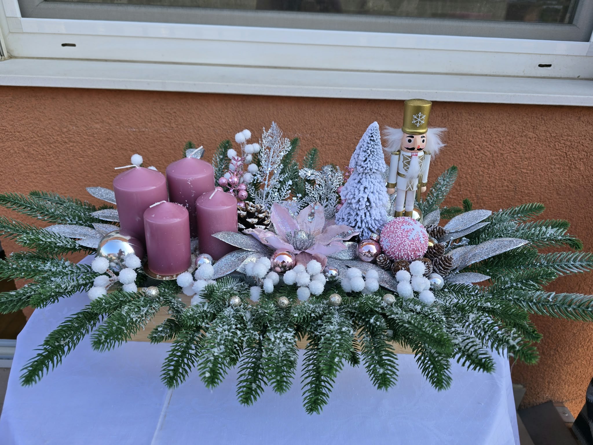 Table advent wreath with a nutcracker and four candles