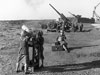 Auxiliary Territorial Service (ATS) girls operate a kine theodolite (used to record on film the accuracy of anti-aircraft shells) at the Royal Artillery anti-aircraft training school at Manobier in South Wales, 29 October 1940.