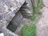 A niche with shelving slots.