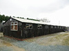 'Laing - A type of plaster board & Tarred paper hut.