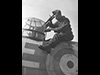 Air gunner cleaning his gun.