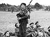 Bill Millin playing to troops.