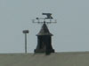 Air vent and weather vane.