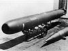 Torpedoes on trolleys.