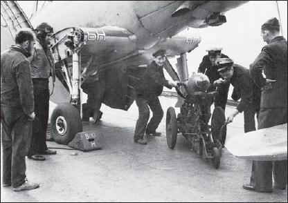 A 500lb bomb is loaded on to a Blackburn Skua of 800 NAS.
    How the navy did it, bombing up on HMS Ark Royal.