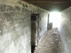 Passage with two doors on the left.