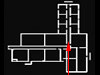 The arrow showing the corridor and at the end a blast wall covering the exit..
