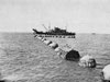 A net being laid across a port.