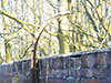 Curved support for barbed wire..