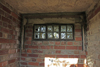 Storehouse window blackout blind is still located around the window..
