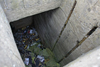 Looking down the escape where there would have been a steel ladder to climb up and a man hole cover over it.