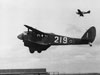 D.H. Dominie 219 flying over the hangar.
