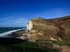 The radar was on the hill and they escaped down this hill and out to sea by RN assault landing craft.