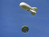 Parachuting from a balloon.