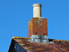 Chimney for the hut can be seen in the old picture.