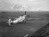 A Spitfire on the grass.
