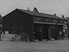 12774/41 four bay M.T. garage this one is steel frame covered in asbestos sheeting.