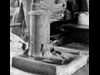 Concrete base under an iron stove.