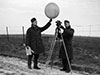 RAF met corporal sending up a gas filled met balloon. By measuring its height and drift will help the met office give an accurate forecast.