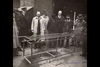 Government officials looking at the designs.