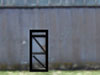 Covered in sheets of corrugated iron only and one small door each side.