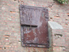 Hurn armoured door to allow access to the rear and armoured to stop any bullets escaping if made of wood.