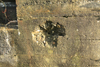 Damage from a bullet. Its still in there.
.