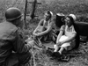 An American officer talking to captured German nurses. Lee Miller.
