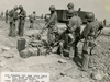 US engineers filling a bunker with 600lb of T.N.T. and 3200gal of oil into a ventilator shaft and then detonated. (13 April 1945).