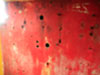 Wall with holes where some form of fittings would have been