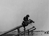 Attaching old shells to wooden platforms to blow up and landing craft that hit them.