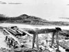A huge gantry was used to lift the guns in place and was captured dismantled on site.