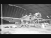 A Spitfire being serviced in a Blister hangar.