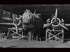 A Wellington under repairs in a hangar.