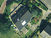 Air photo of the house. You can see the nose of the bunker sticking out at the front.