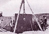 Metal plate being fitted into a casemate.