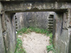 View into the gun room and the slots for shelving to place spare  machine gun ammunition.