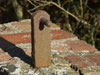 The gate hinge.