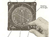Adjusting the compass.