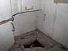Spent case man hole with three steel hand holds and steps.