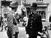 Luftwaffe Officer talking to a local Policeman.