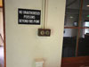 Light switches, sign. "No unauthorised Persons Beyond this Point".