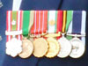 Oman  The Special Royal Decoration for  Officers, second class in silver.
The Oman Peace Medal. 
The Oman 15th Anniversary Medal.
Omani Army 20th National Day 1990.
