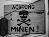 Yellow writing on the sign would mean it was a dummy mine field.