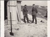 Digging toilets in the sand.